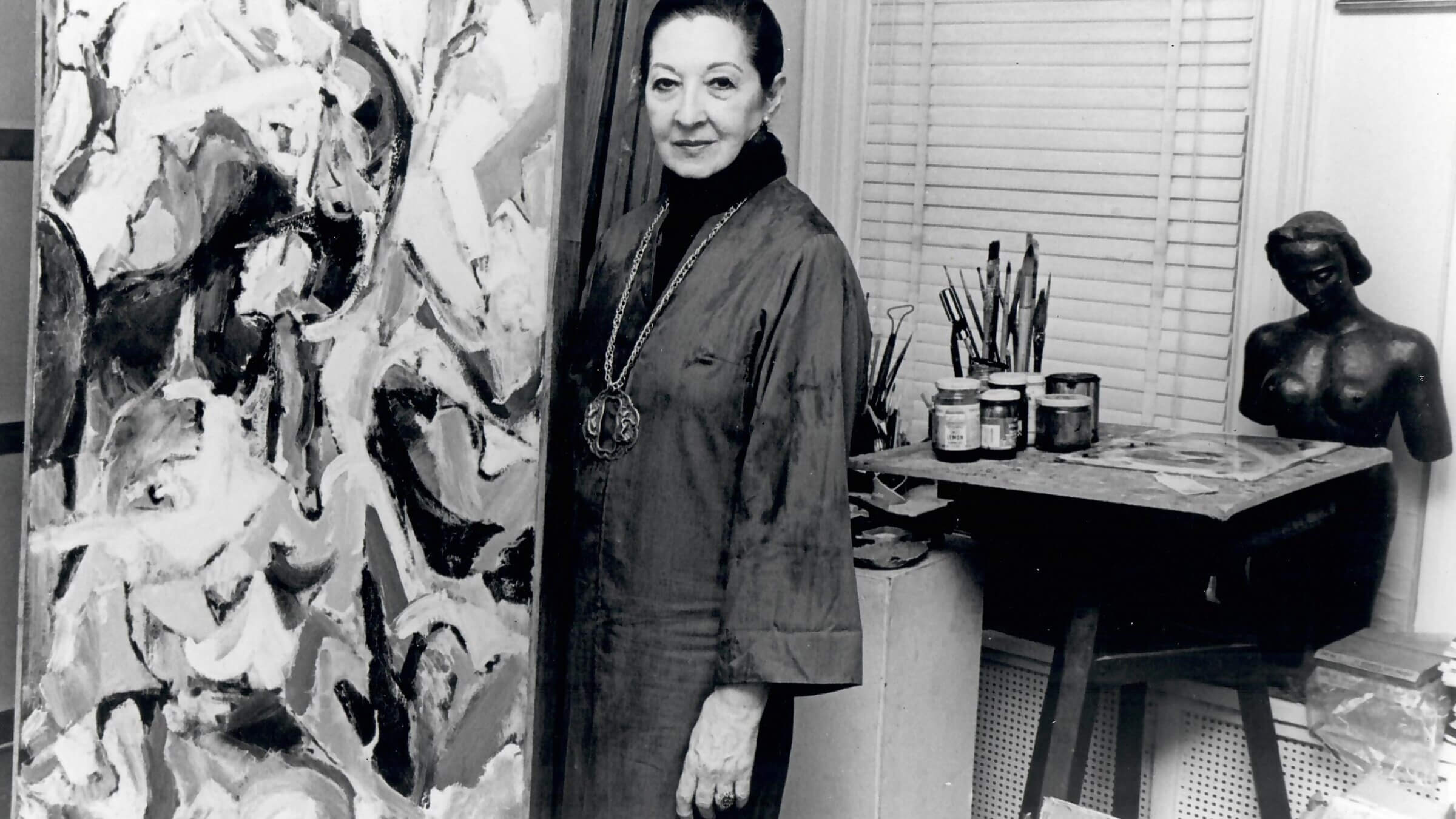 Anna Walinska with her painting <i>The Naked and the Dead</i>.