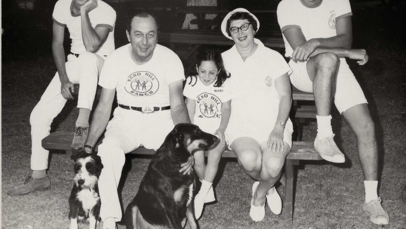 The Friedmans at a picnic bench with Laddie, the dog.