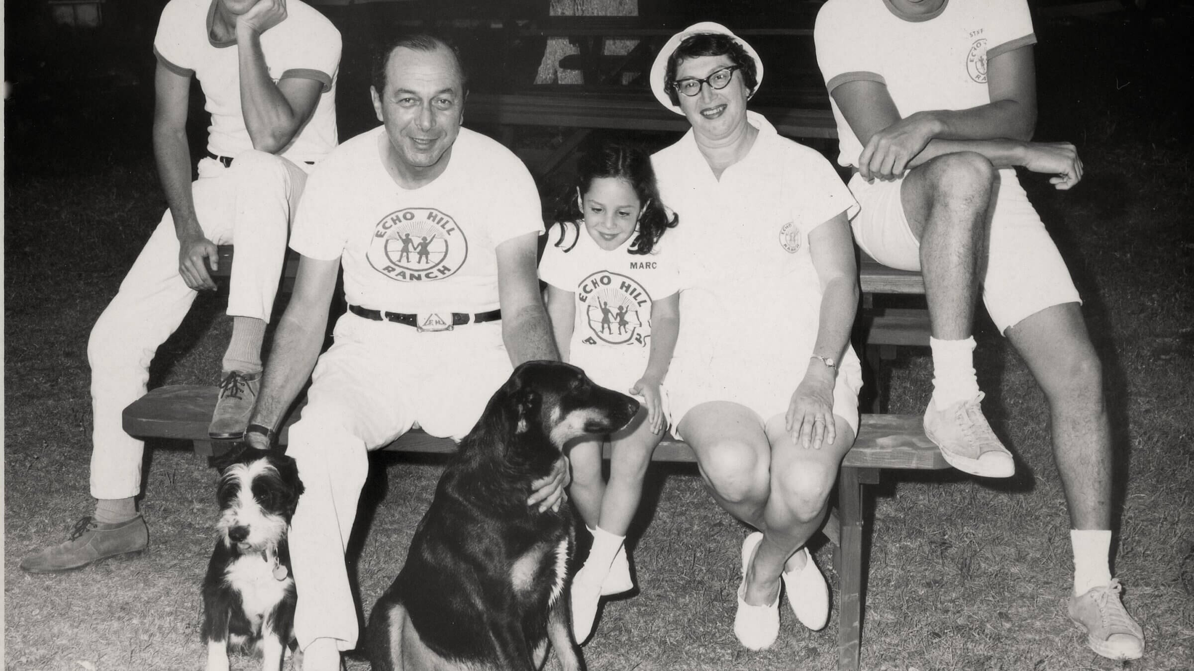 The Friedmans at a picnic bench with Laddie, the dog.