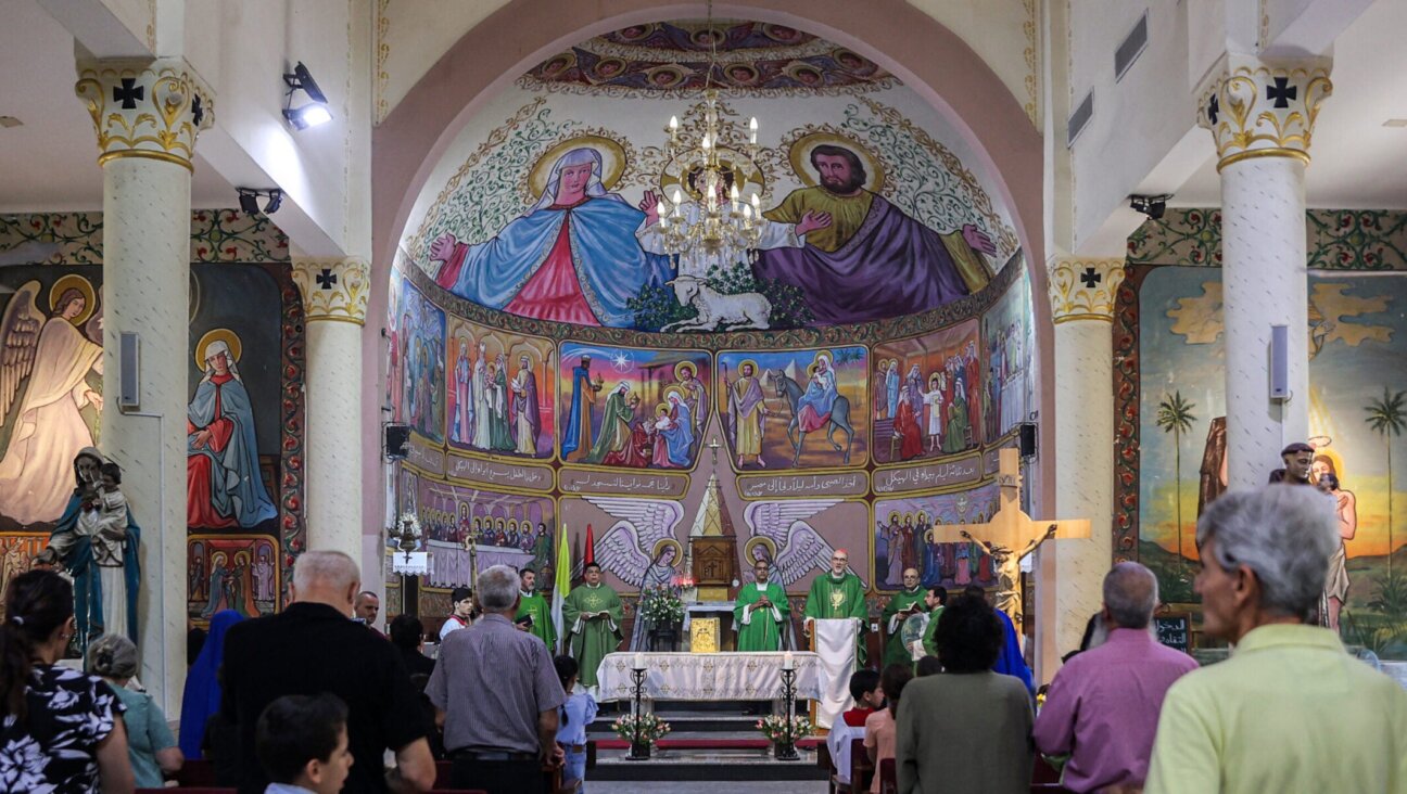 Worshippers attend a Sunday morning mass led by Cardinal Pierbattista Pizzaballa, Latin Patriarch of Jerusalem, at the Roman Catholic Church of the Holy Family in Gaza City on July 20, 2025. 