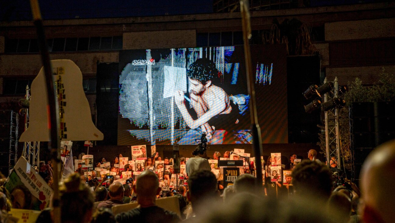 An image of Evyatar David from a video released by Hamas is shown at a rally in Tel Aviv, Aug. 2, 2025. 