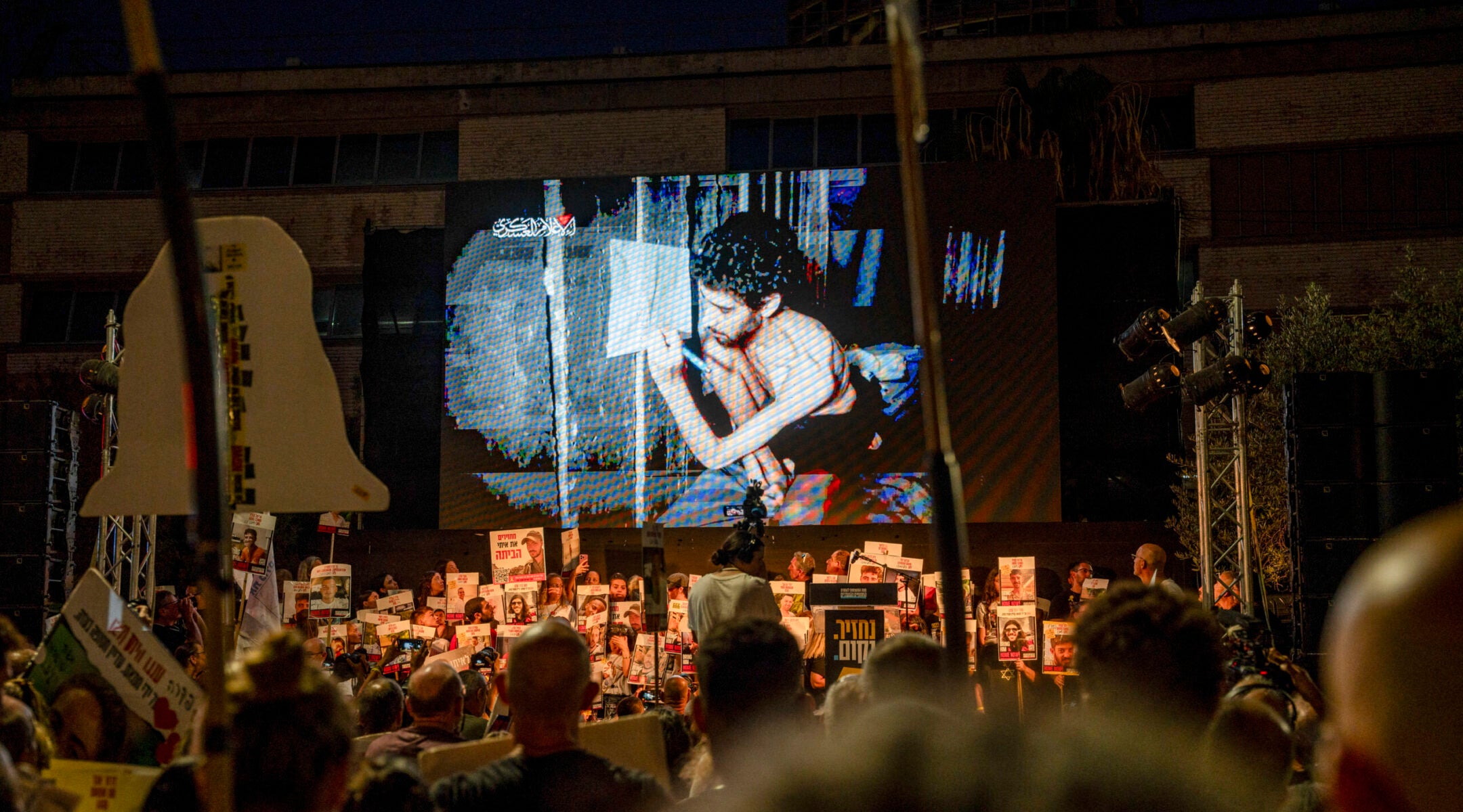 An image of Evyatar David from a video released by Hamas is shown at a rally in Tel Aviv, Aug. 2, 2025. 