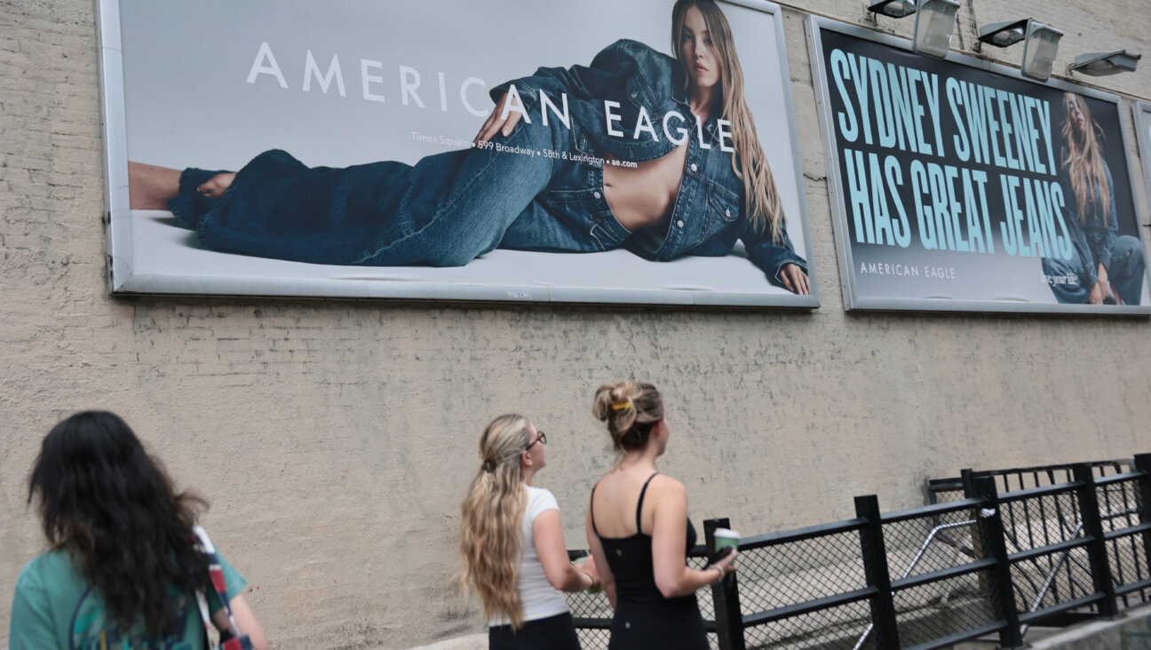 Billboards of actress Sydney Sweeney are seen outside of an American Eagle store; the ads are also posted on social media platforms.