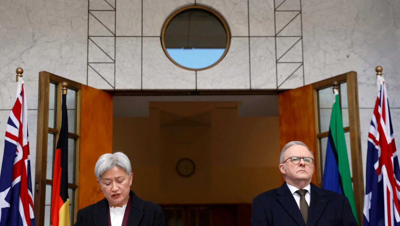 Australia’s Foreign Minister Penny Wong speaks next to Prime Minister Anthony Albanese during a press conference to announce Australia’s recognition of a Palestinian state, in Canberra, Aug. 11, 2025.