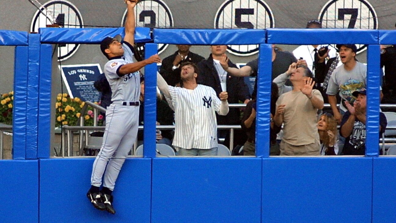 Seattle Mariner Stan Javier robs Alfonso Soriano of a home run — and the author of this article (pictured in Yankees uniform) of a souvenir.