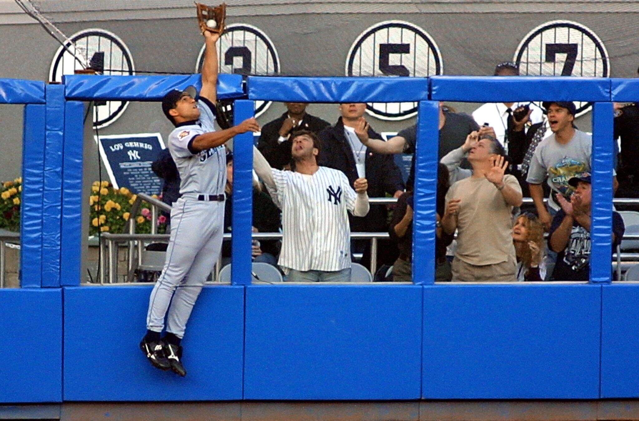 Seattle Mariner Stan Javier robs Alfonso Soriano of a home run — and the author of this article (pictured in Yankees uniform) of a souvenir.