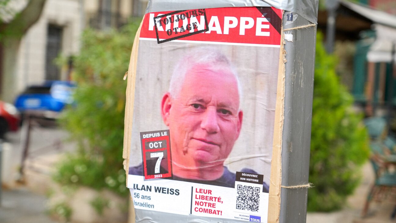 A poster of a photo of Israeli hostage Ilan Weiss, kidnapped on October 7, 2023 in the Gaza Strip, on a pole in a street in Avignon, France, on April 27, 2025. 