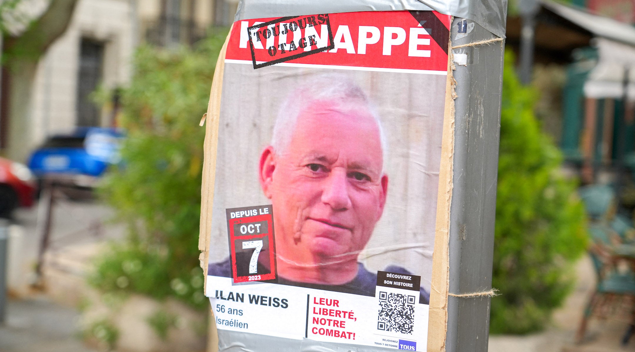 A poster of a photo of Israeli hostage Ilan Weiss, kidnapped on October 7, 2023 in the Gaza Strip, on a pole in a street in Avignon, France, on April 27, 2025. 