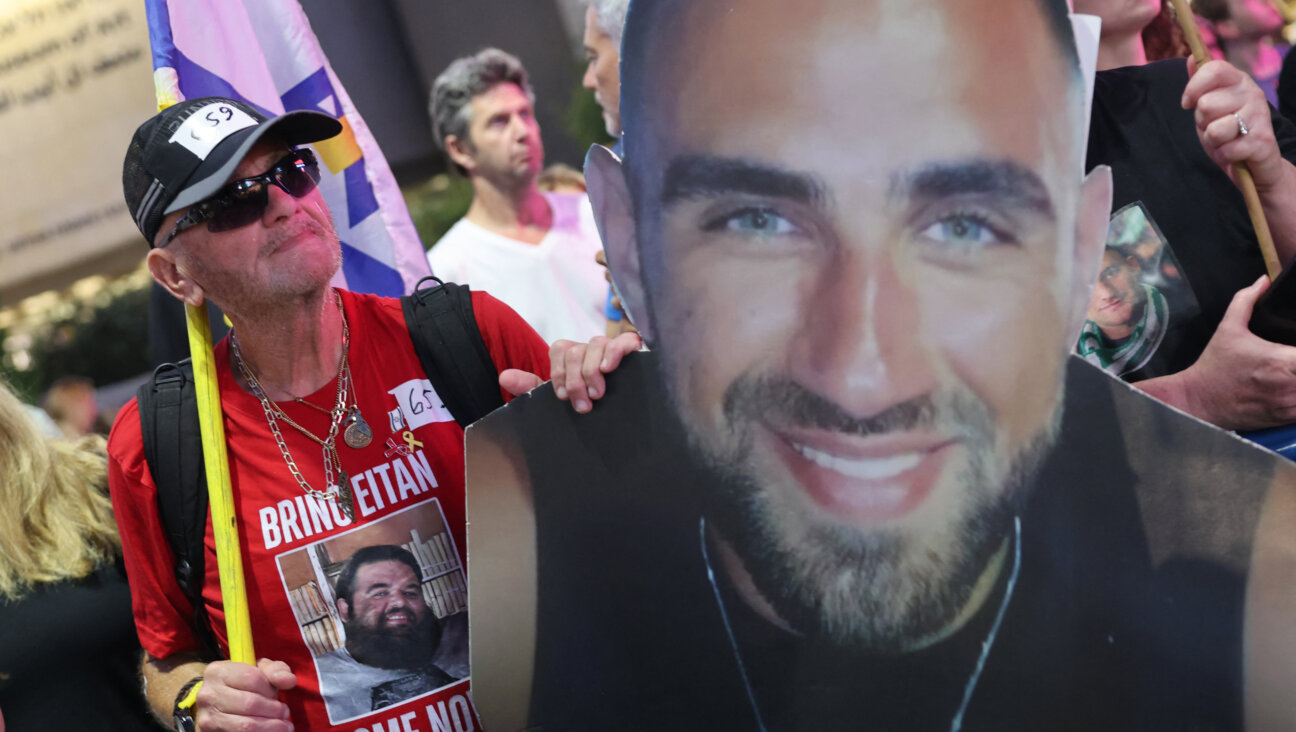 People show pictures of Israeli hostages during an anti-government protest in Tel Aviv calling for the end of the war and action to secure the release of Israeli hostages held captive in the Gaza Strip, July 26.