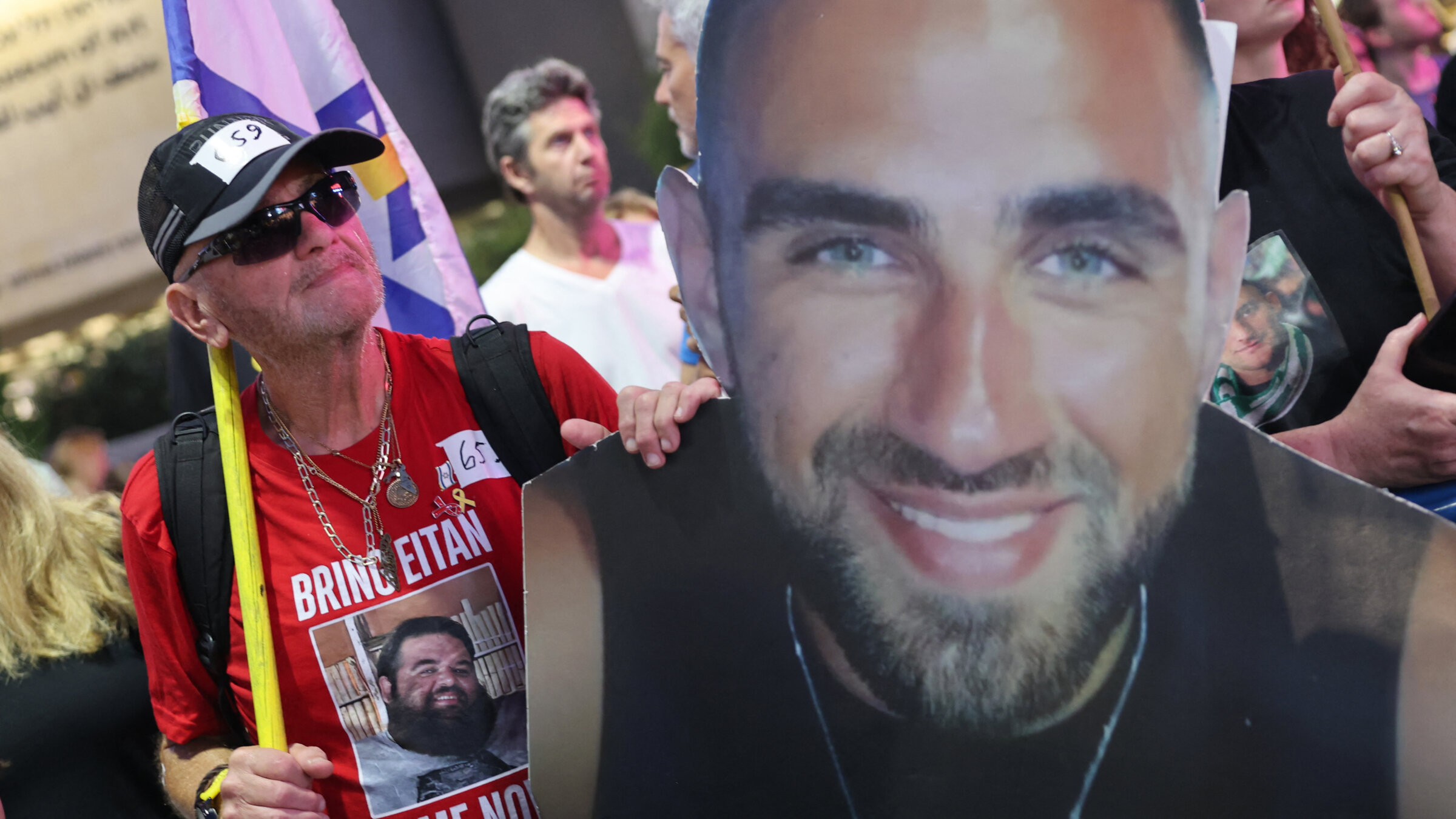 People show pictures of Israeli hostages during an anti-government protest in Tel Aviv calling for the end of the war and action to secure the release of Israeli hostages held captive in the Gaza Strip, July 26.