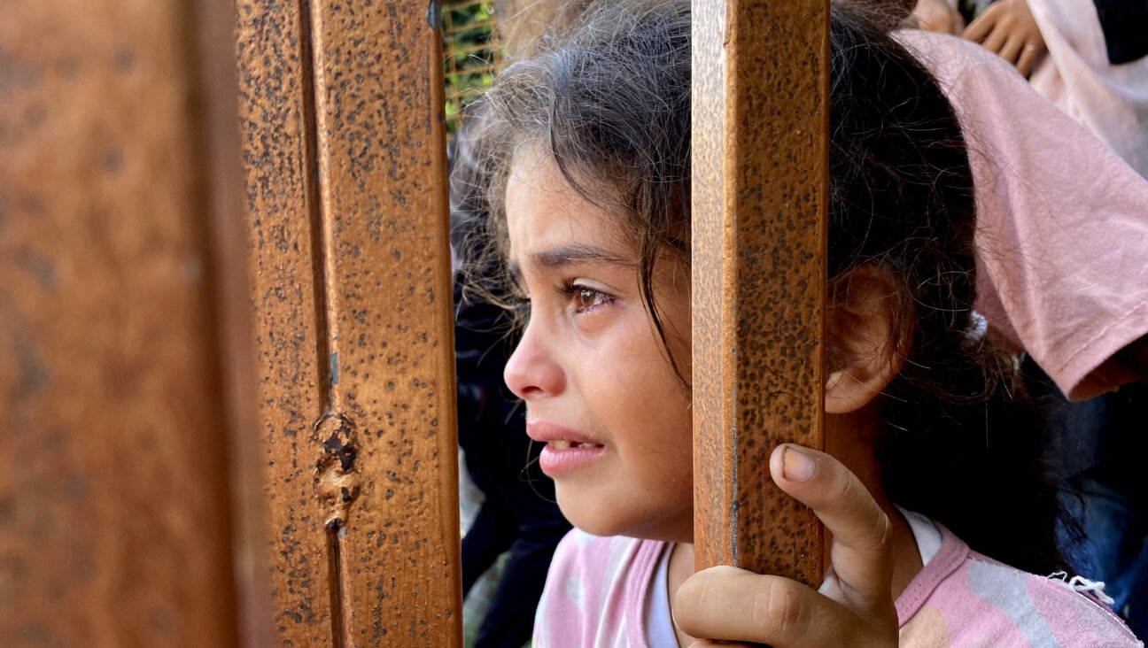 A girl reacts during the funeral for victims killed by Israeli bombardment on the Mawasi area of Khan Yunis, at Nasser Medical Complex in the Gaza Strip on July 28.