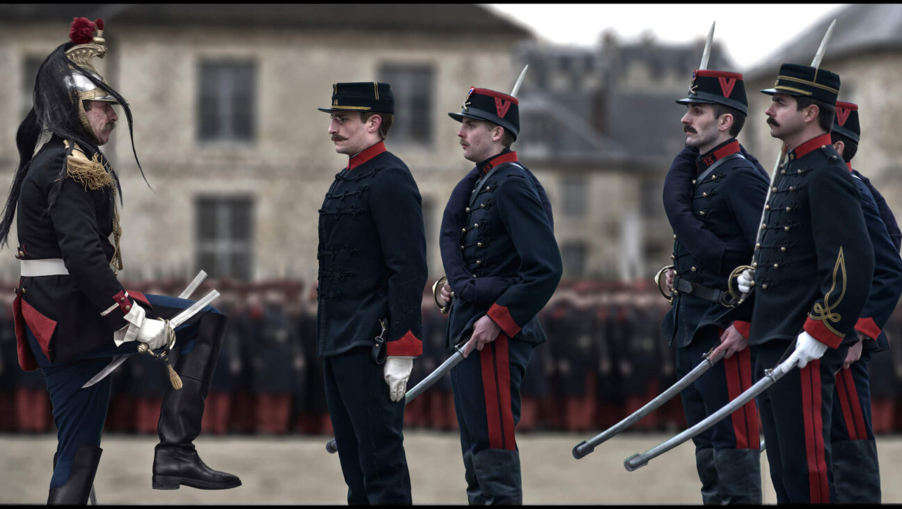 Alfred Dreyfus (Louis Garrel, second from left) undergoes the punishment of being degraded in Roman Polanski's "An Officer and a Spy."