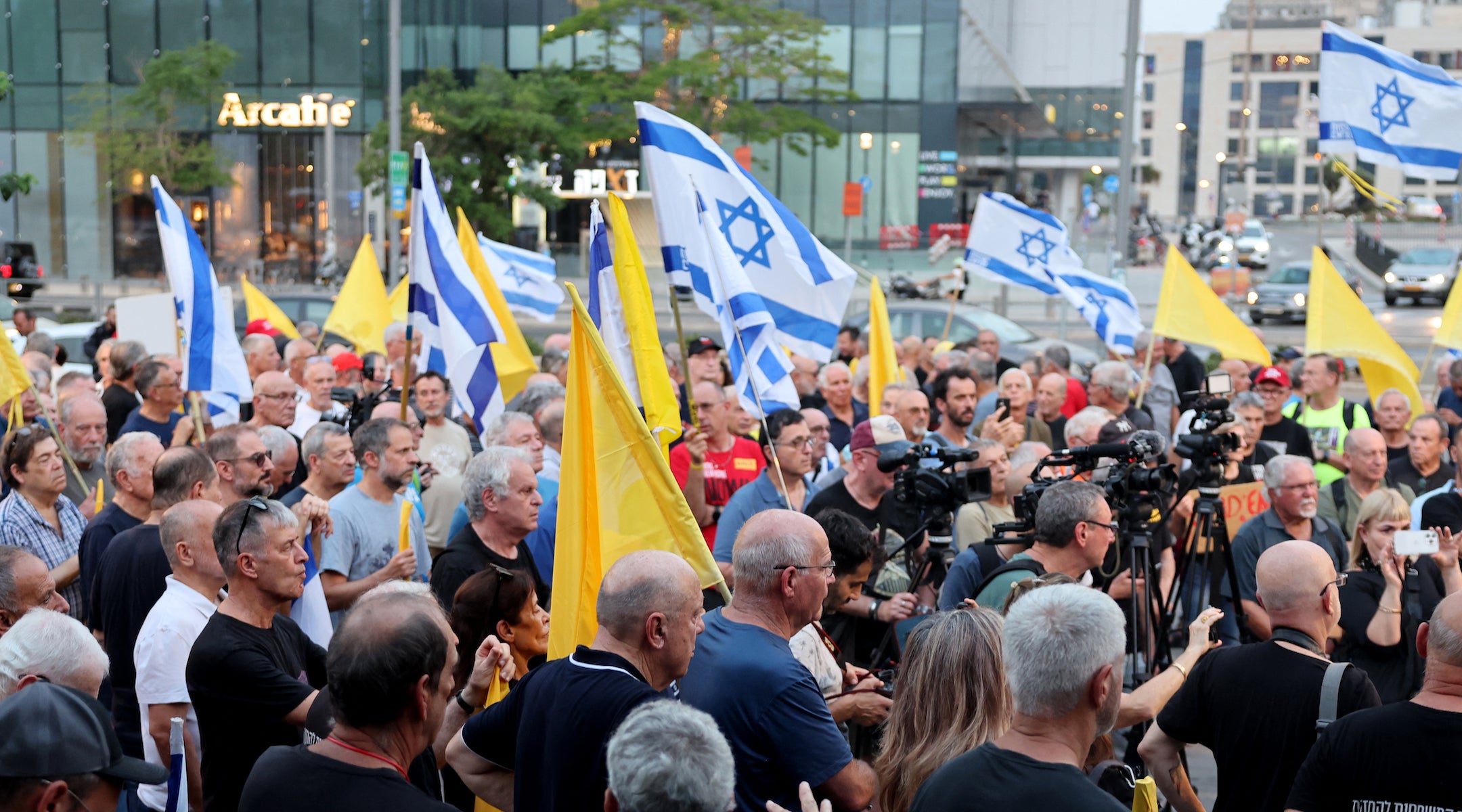 Retired and reserve Israeli Air Force pilots attend a rally calling for an immediate end to the war and urgent action to repatriate the hostages captive in Gaza since October 2023, on August 12, 2025, outside the Israeli Army headquarters in Tel Aviv.