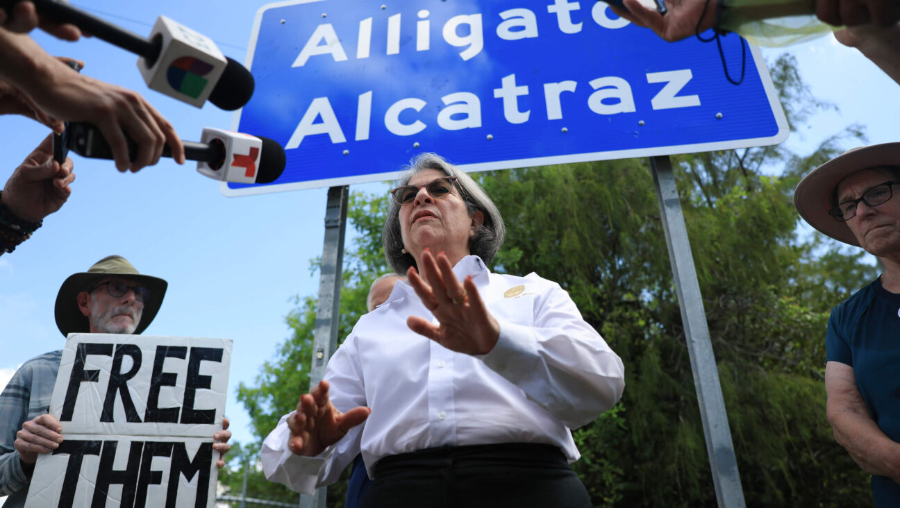 Miami-Dade County Mayor Daniella Levine Cava speaks to the media at the entrance to "Alligator Alcatraz" on Aug. 22 in Ochopee, Florida. The mayor spoke about her support for a decision by a federal judge that ordered an indefinite halt to new construction at the immigration detention facility, and barred any new detainees from being brought to the site, siding with environmental groups who said the facility is endangering the Everglades and its wildlife.