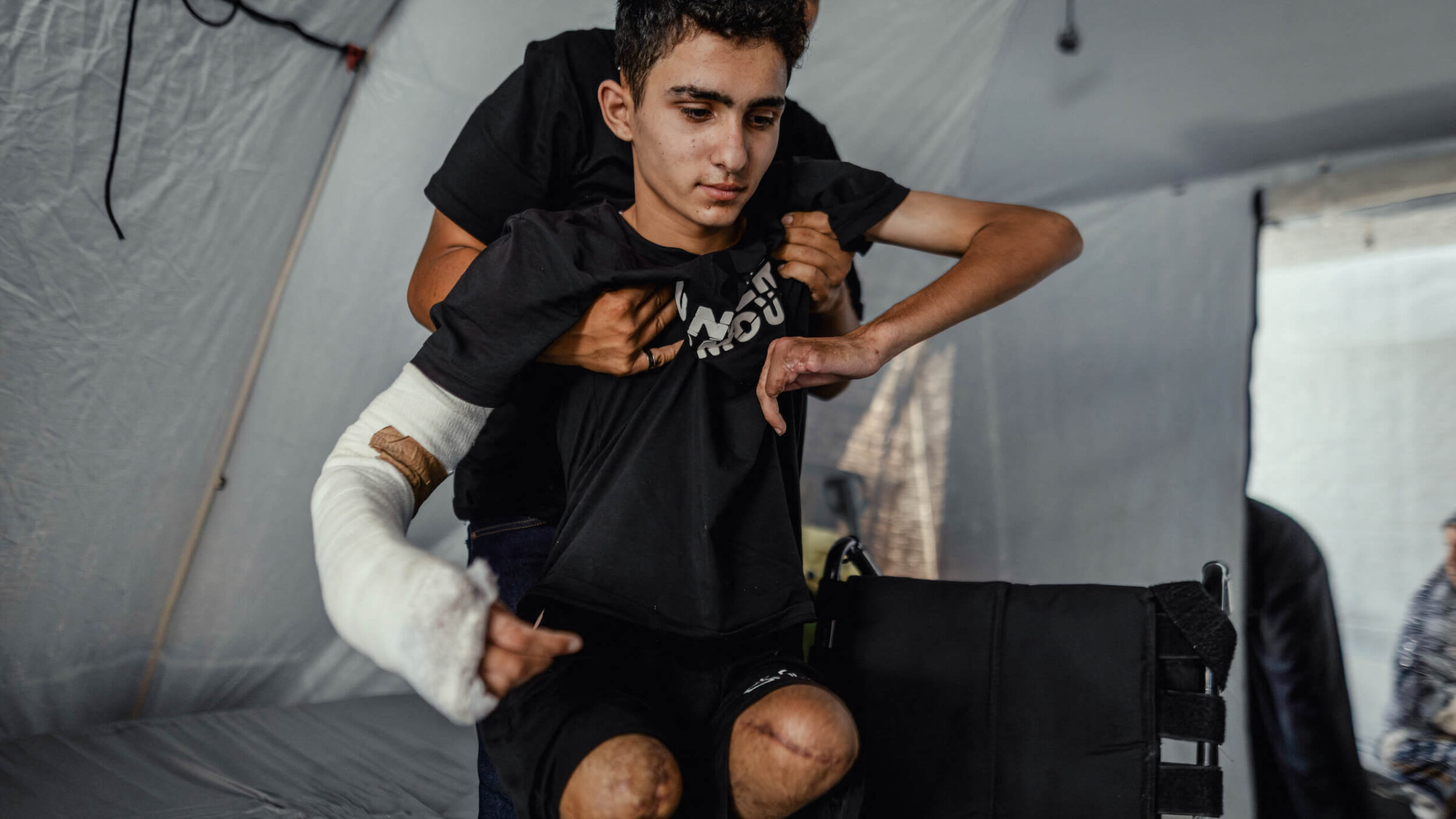 Ahmad Abdullah Al-Ghalban, a 16-year-old Palestinian boy in Gaza whose injuries sustained in an Israeli airstrike — which killed his brother — led to the amputation of both his legs and the loss of several fingers on his hand. Since the incident, the Al-Ghalban family has lacked shelter and adequate medical care.