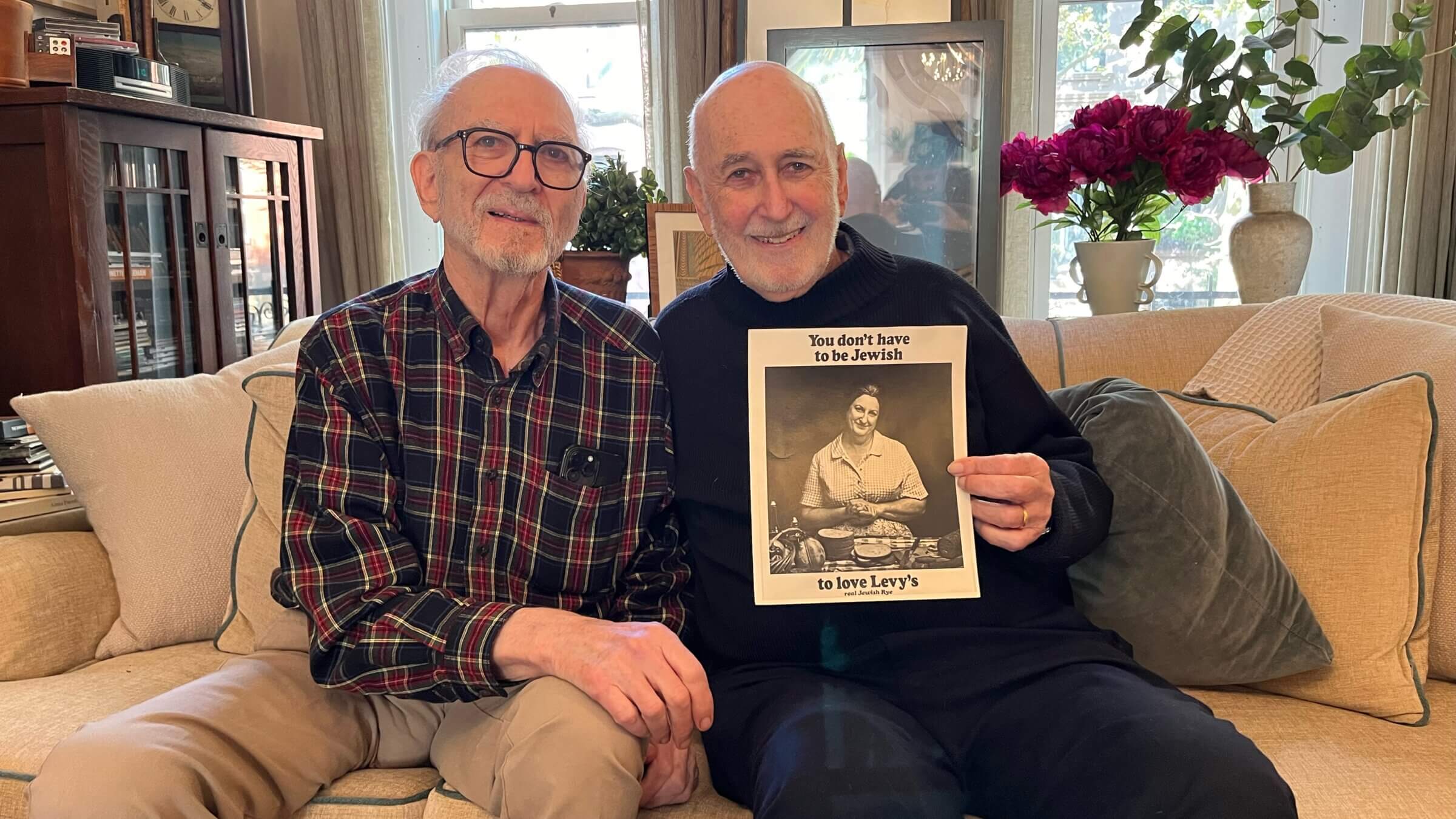 Philip and Leonard Lopate and a photo of their mother Fran Lopate, spokesmodel for Levy's Rye.