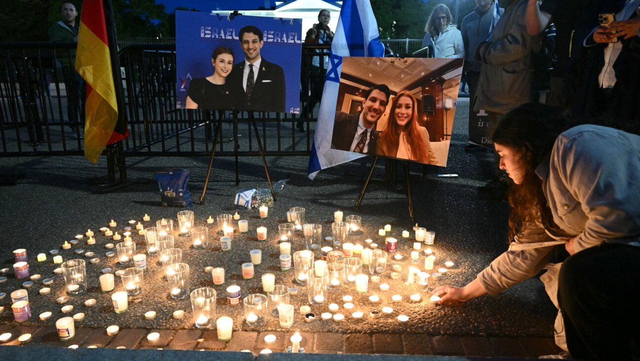 People attend a candlelight vigil at Lafayette Square across from the White House in Washington, DC on May 22, 2025, following a shooting that left two Israeli embassy staffers dead.