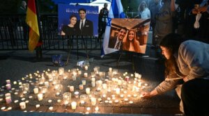 People attend a candlelight vigil at Lafayette Square across from the White House in Washington, DC on May 22, 2025, following a shooting that left two Israeli embassy staffers dead.
