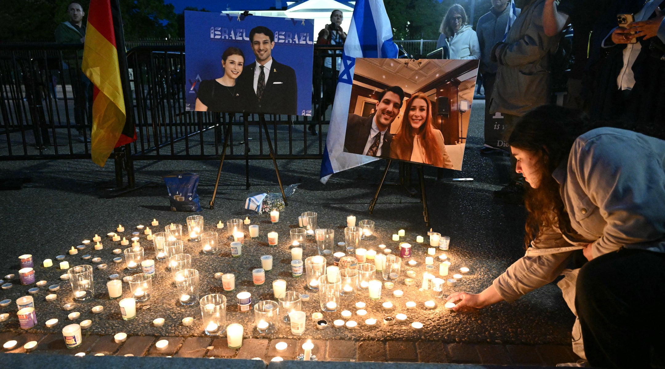 People attend a candlelight vigil at Lafayette Square across from the White House in Washington, DC on May 22, 2025, following a shooting that left two Israeli embassy staffers dead.