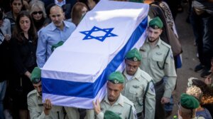 Family and friends attend the funeral of Sergeant Ross Elisheva Rose Ida Lubin at Mount Herzl Military Cemetery in Jerusalem on November 9, 2023. Lubin was killed in a stabbing attack near Jerusalem’s Old City by a 16-year old resident of the East Jerusalem neighborhood of Issawiya a few days ago.
