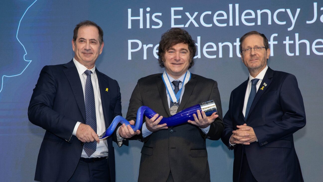 President of Argentina Javier Milei poses holding the Genesis Prize with Stan Polovets and Israeli President Isaac Herzog during the Genesis Prize ceremony at The Museum of Tolerance on June 12, 2025 in Jerusalem, Israel. 