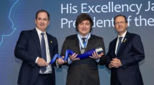 President of Argentina Javier Milei poses holding the Genesis Prize with Stan Polovets and Israeli President Isaac Herzog during the Genesis Prize ceremony at The Museum of Tolerance on June 12, 2025 in Jerusalem, Israel. 