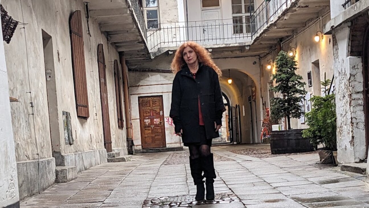 Rabbi Tanya Segal stands in the courtyard of 12 Jozefa Street in Krakow, Poland, as she is evicted from her apartment, July 31, 2025. 