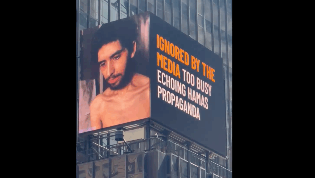 A billboard in New York City’s Times Square displaying a video released last week by Hamas of one of its Israeli hostages, Evyatar David. (Screenshot)
