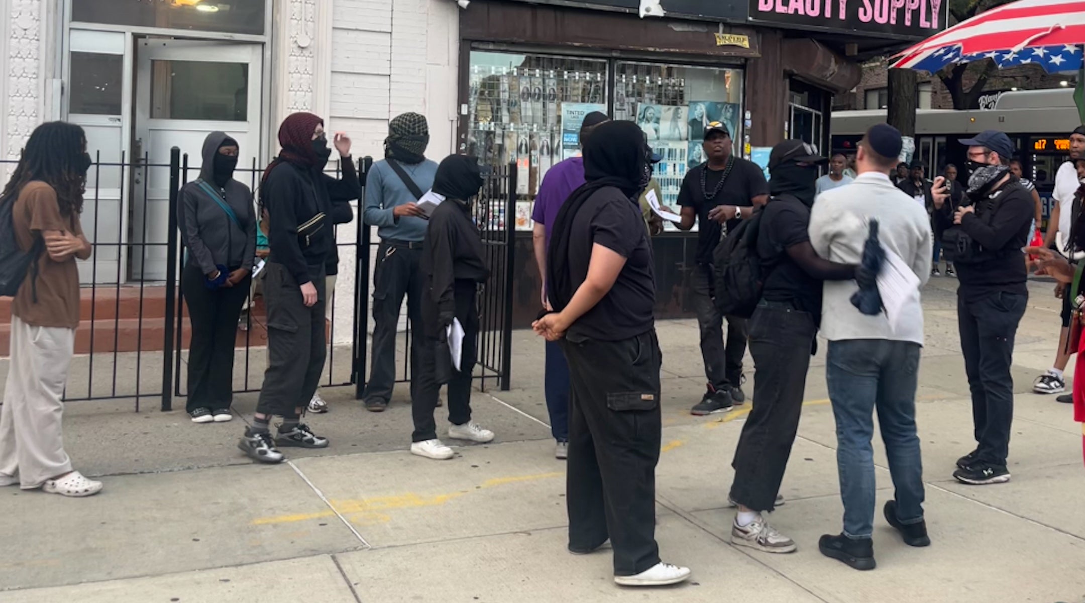 Crown Heights Bites Back members shoved a Jewish man that attempted to approach their vigil for Gavin Cato on August 19, 2025.