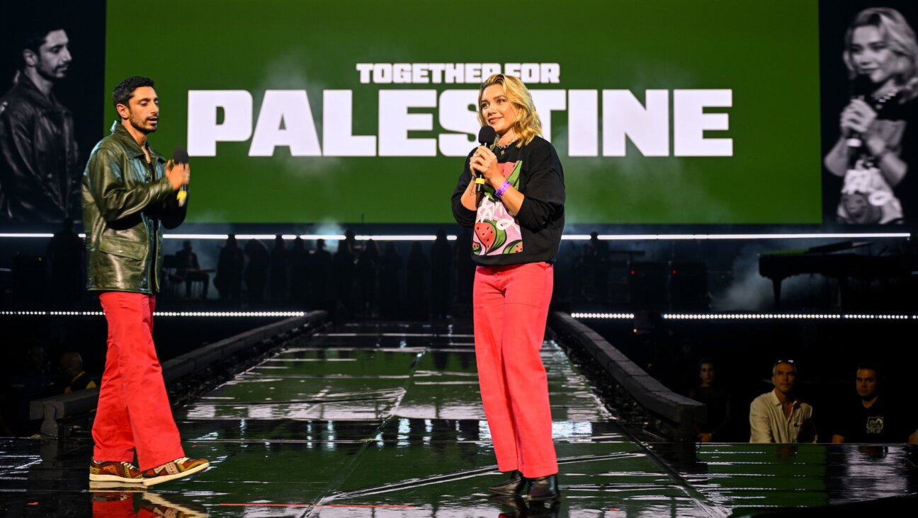 Riz Ahmed and Florence Pugh speak onstage during the Together For Palestine concert at Wembley Arena on September 17, 2025 in London, England. 