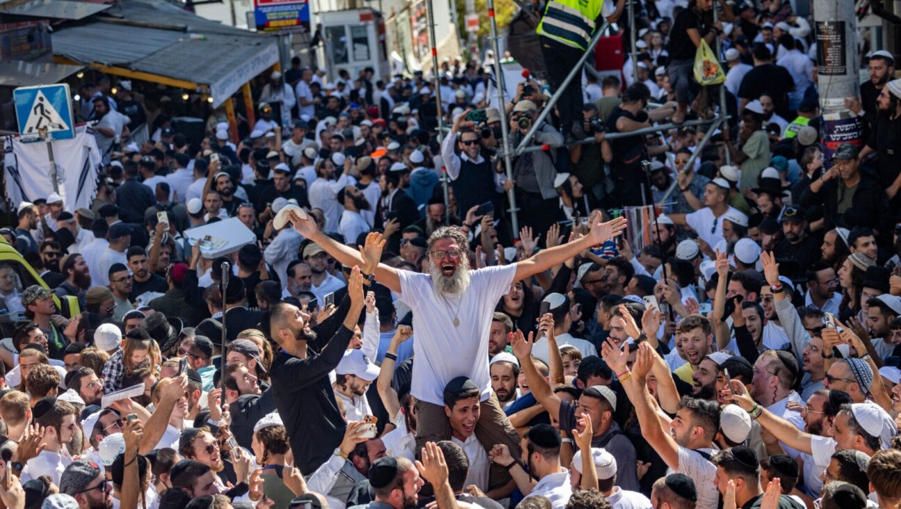 Jewish men in the street during Tikkun HaKlali near the tomb of Rabbi Nachman of Breslov in Uman, on eve of the Jewish holiday of Rosh Hashanah, Sept. 22, 2025. 