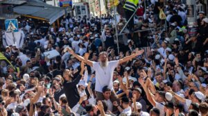 Jewish men in the street during Tikkun HaKlali near the tomb of Rabbi Nachman of Breslov in Uman, on eve of the Jewish holiday of Rosh Hashanah, Sept. 22, 2025. 