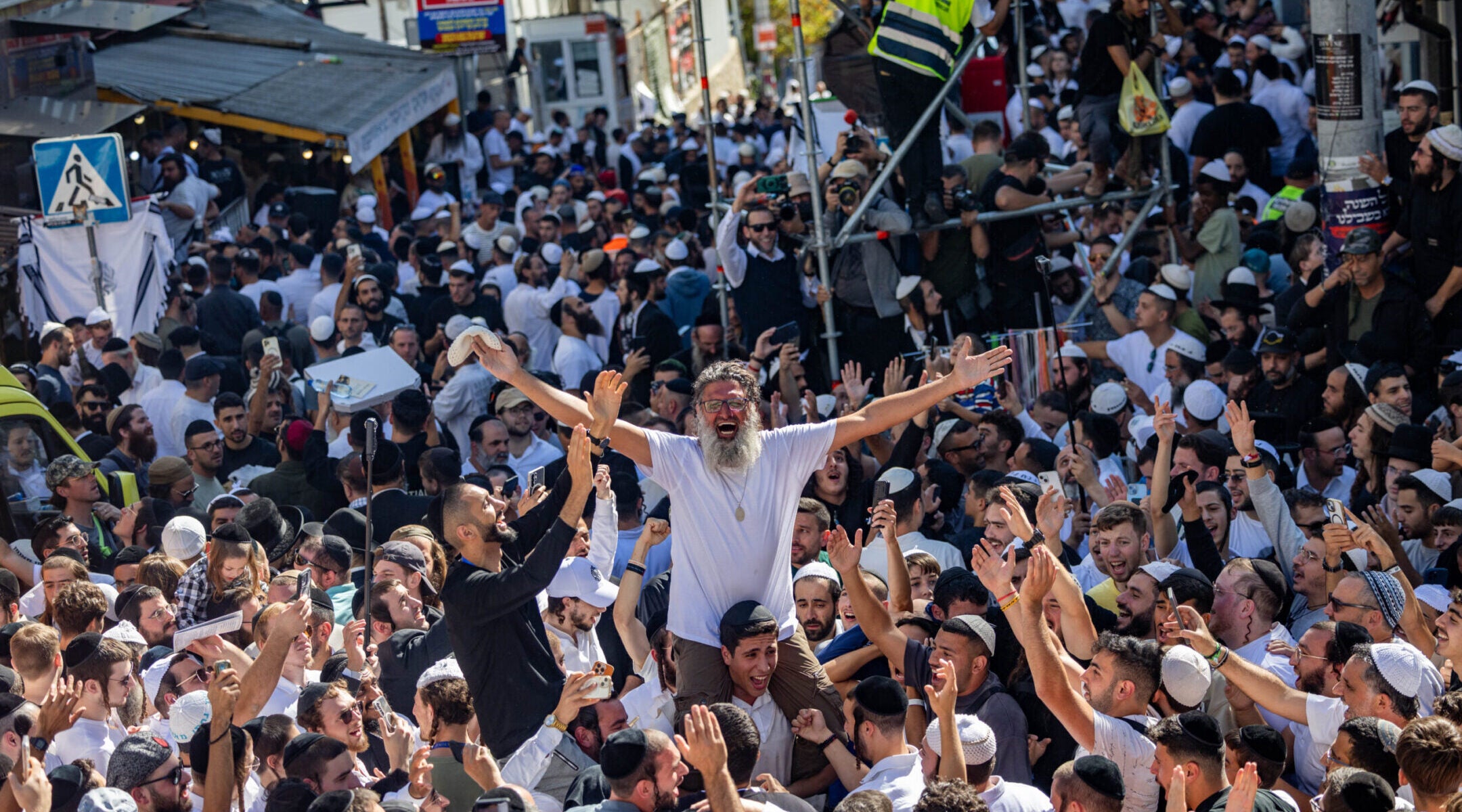 Jewish men in the street during Tikkun HaKlali near the tomb of Rabbi Nachman of Breslov in Uman, on eve of the Jewish holiday of Rosh Hashanah, Sept. 22, 2025. 