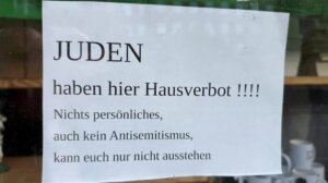 A photograph of an antisemitic sign on a shop window in Flensburg, Germany, went viral in September 2025. 