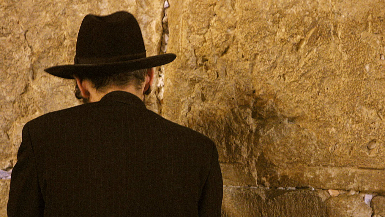 A man at the Western Wall prays for forgiveness.
