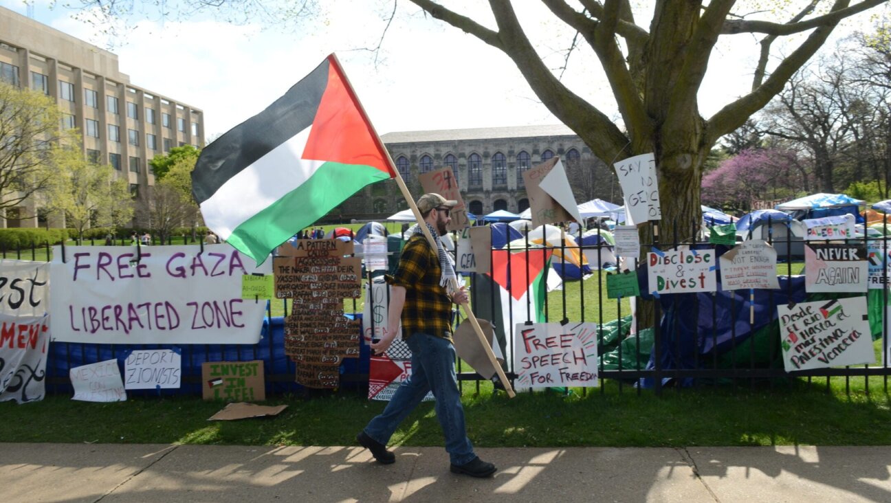 Banners hanging from the fence outside Northwestern University during a pro-Palestinian protest, Evanston, Illinois, April 27, 2024. 