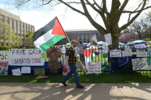 Banners hanging from the fence outside Northwestern University during a pro-Palestinian protest, Evanston, Illinois, April 27, 2024. 