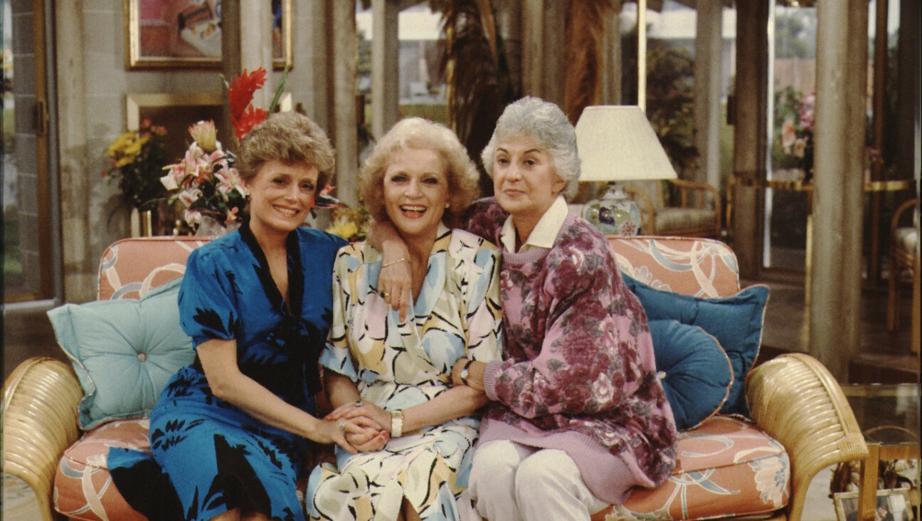 Actresses (L-R) Rue Mclanahan, Betty White, and Bea Arthur pose for a portrait on the set of the Golden Girls.