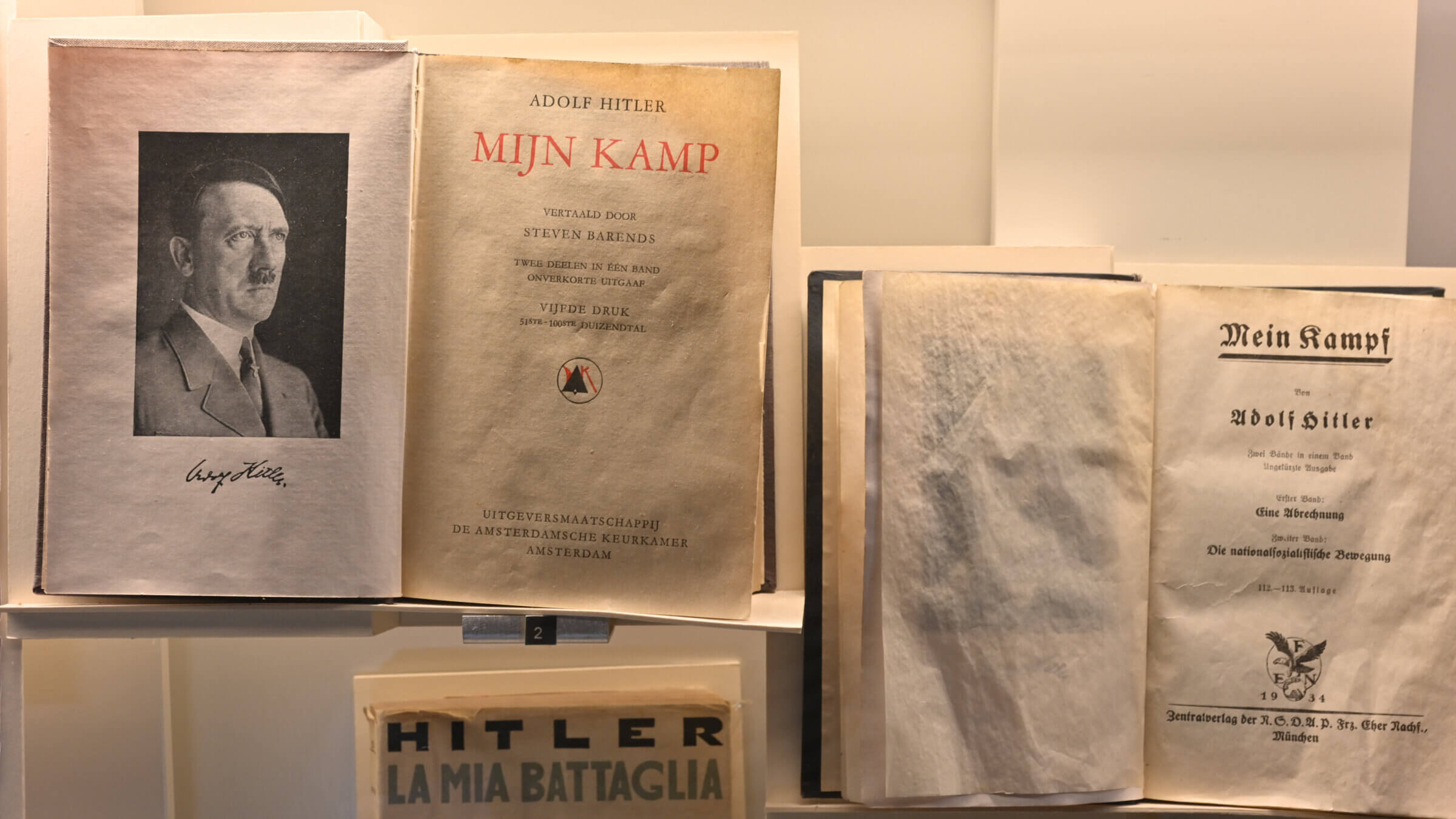 Adolf Hitler's <I>Mein Kampf</I>, accompanied by his portrait, at the Shoah Memorial in Paris, France.