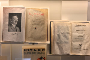 Adolf Hitler's "Mein Kampf," accompanied by his portrait, at the Shoah Memorial in Paris, France, on August 6, 2025.