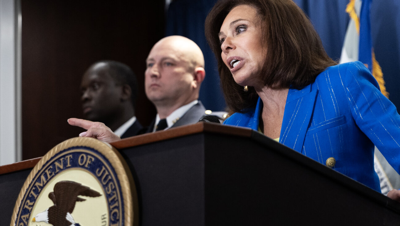 U.S. Attorney for Washington, D.C. Judge Jeanine Pirro, center, speaks during a news conference regarding an update on the deadly shooting that occurred at the Jewish Capital Museum in May, at the U.S. Department of Justice Building on August 7, 2025 in Washington.