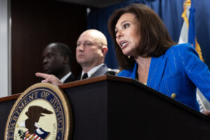 U.S. Attorney for Washington, D.C. Judge Jeanine Pirro, center, speaks during a news conference regarding an update on the deadly shooting that occurred at the Jewish Capital Museum in May, at the U.S. Department of Justice Building on August 7, 2025 in Washington.