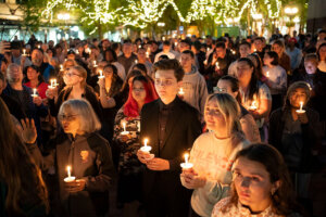 Attendees at a candlelight vigil and prayer service for Charlie Kirk in Seattle on September 10.