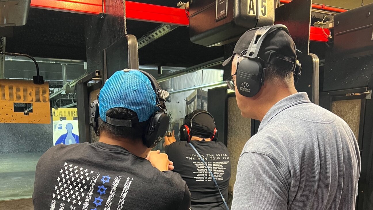 Lox & Loaded members learn how to use firearms at a shooting range.