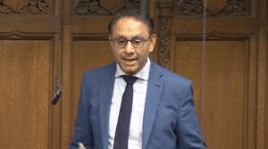 Independent British lawmaker Shockat Adam gives an address in Parliament Wednesday.