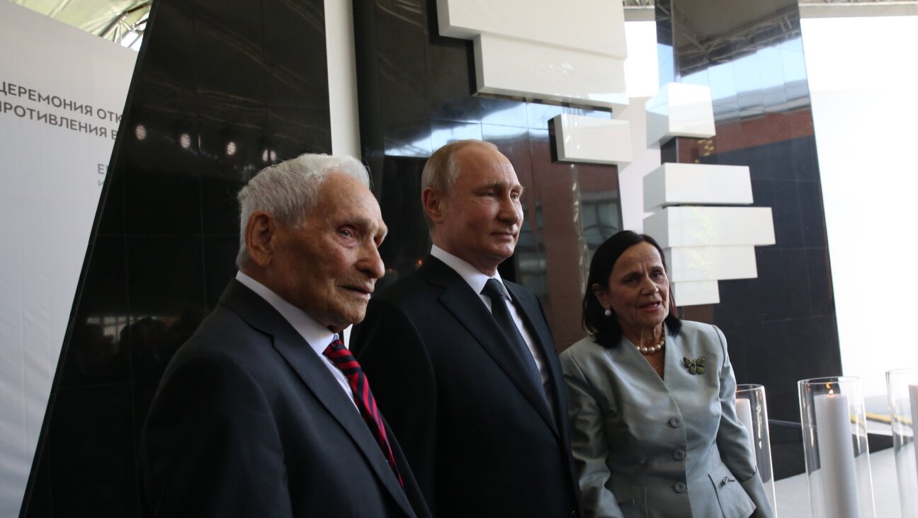 Russian President Vladimir Putin and Aron Bell pose for a photo at the Jewish Museum and Tolerance Center in Moscow, Russia on June 4, 2019. 