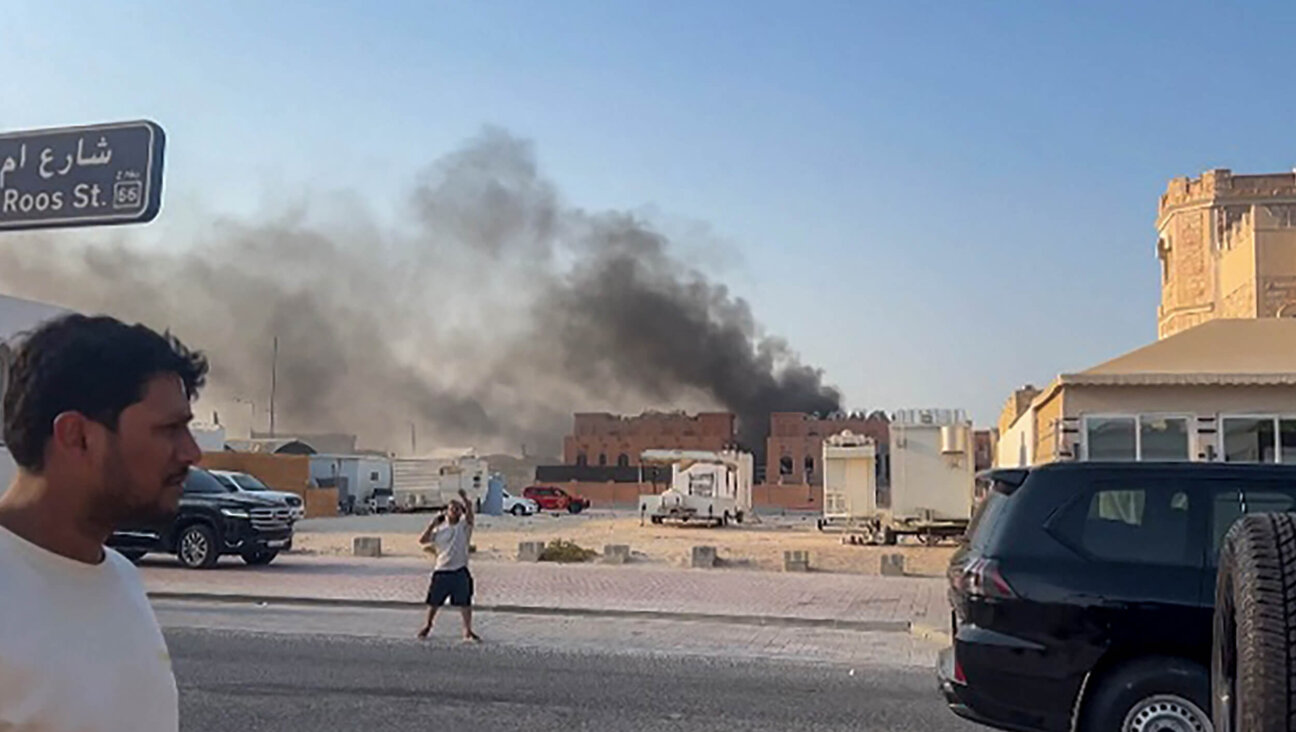 A frame grab taken from AFPTV footage shows smoke billowing after explosions in Qatar's capital Doha on Sept. 9. An Israeli military official told AFP that the military had carried out air strikes  in an operation targeting senior leaders of Hamas.
