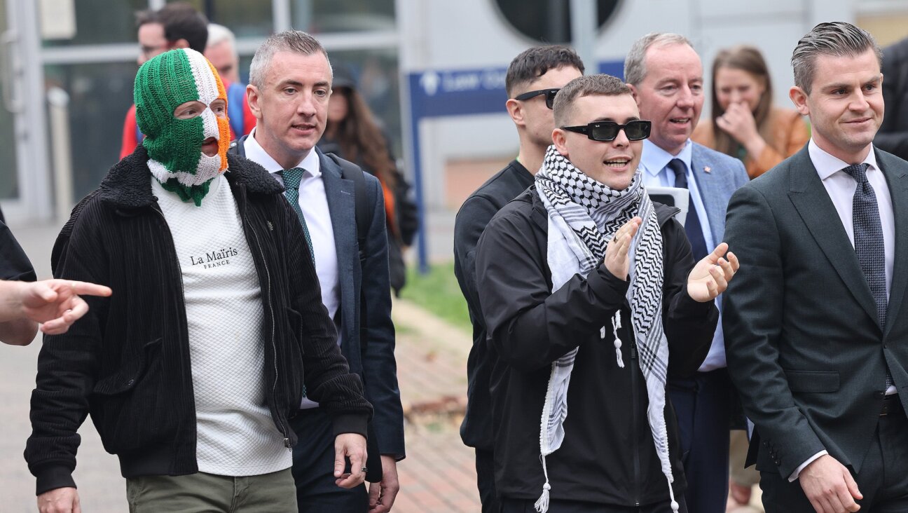 Members of the band Kneecap, including singer Liam O’Hanna (C) leaving Woolwich Crown Court on September 26, 2025 in London, England.