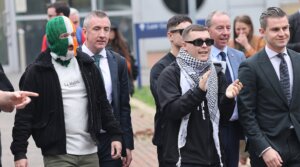 Members of the band Kneecap, including singer Liam O’Hanna (C) leaving Woolwich Crown Court on September 26, 2025 in London, England.