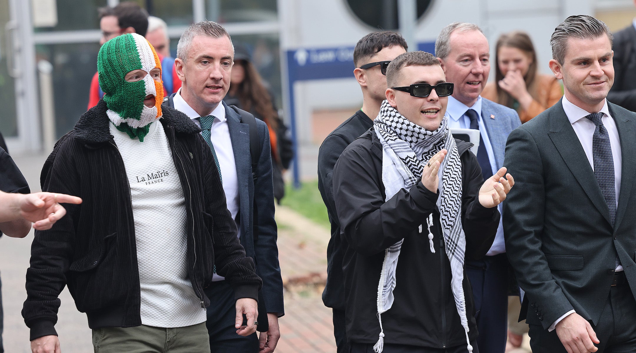 Members of the band Kneecap, including singer Liam O’Hanna (C) leaving Woolwich Crown Court on September 26, 2025 in London, England.